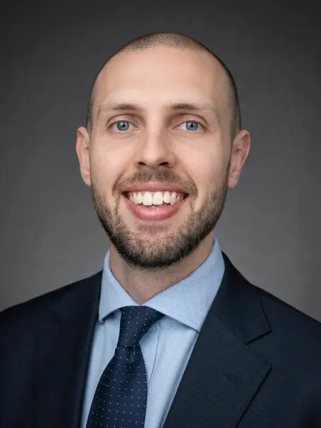 Ben Watt, Financial Adviser, in business attire, smiling