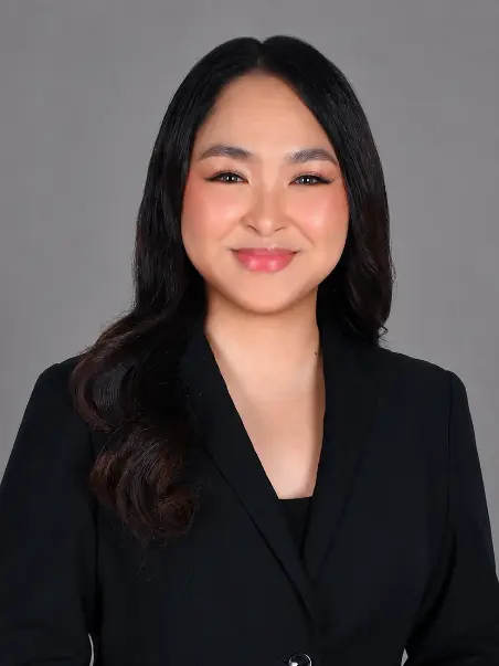 Kiara Exchaure, Paraplanner, in business attire, smiling